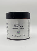 Jar of Blue Dew sugar scrub on a white background