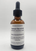 Bottle of 'Fairest One of All' scented body oil on a white background