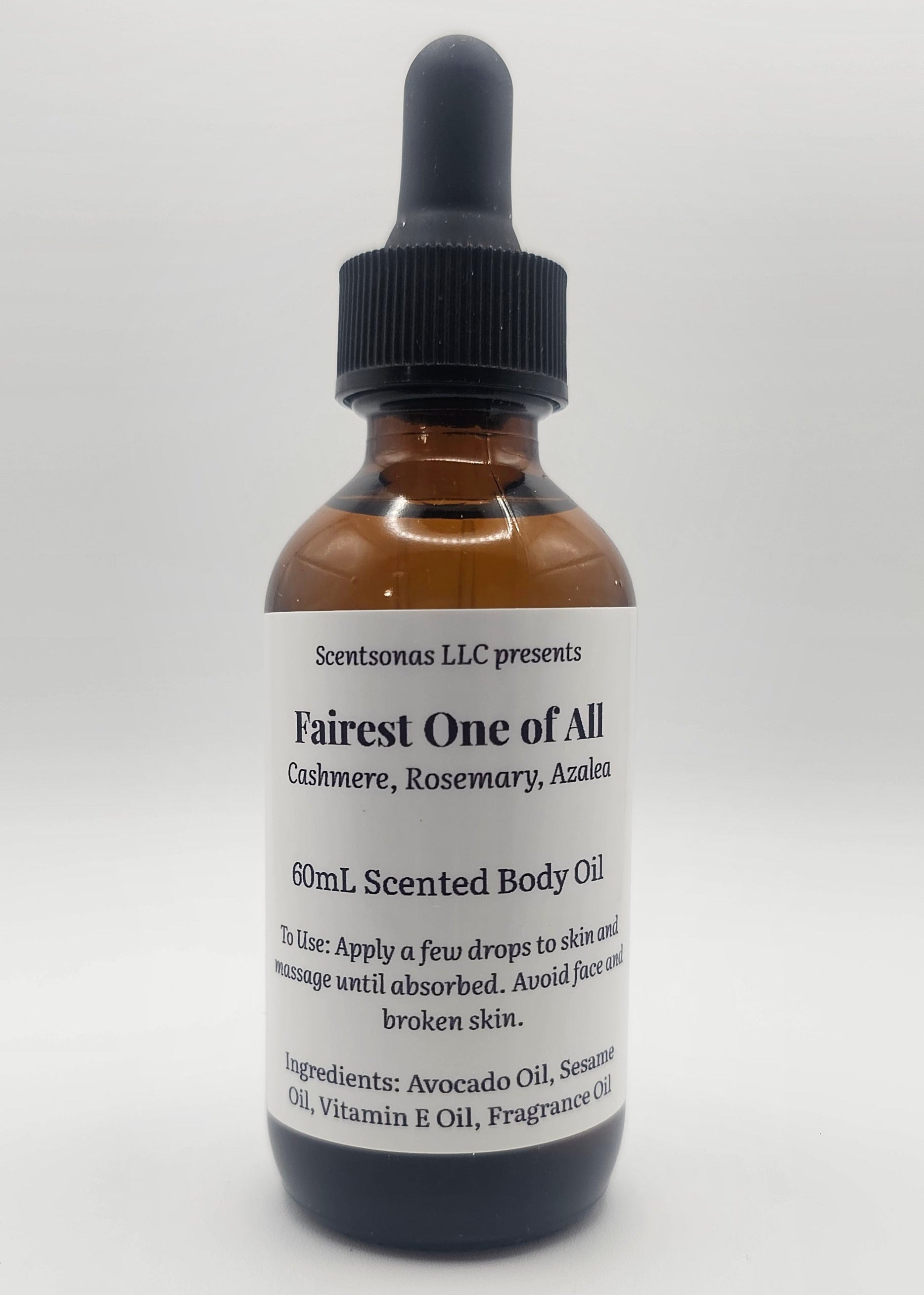 Bottle of 'Fairest One of All' scented body oil on a white background