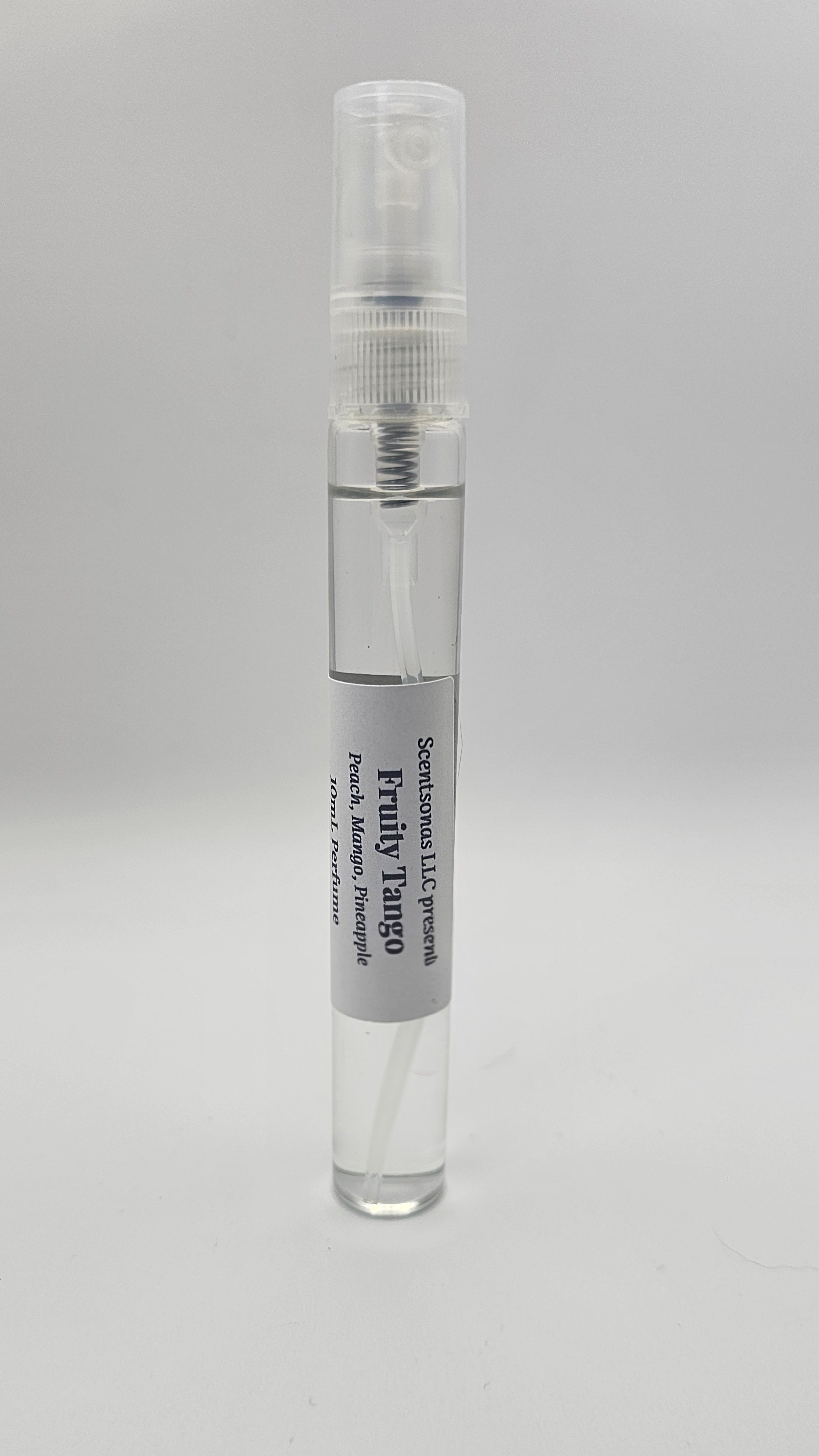 Small spray bottle with a gray label on a light gray background