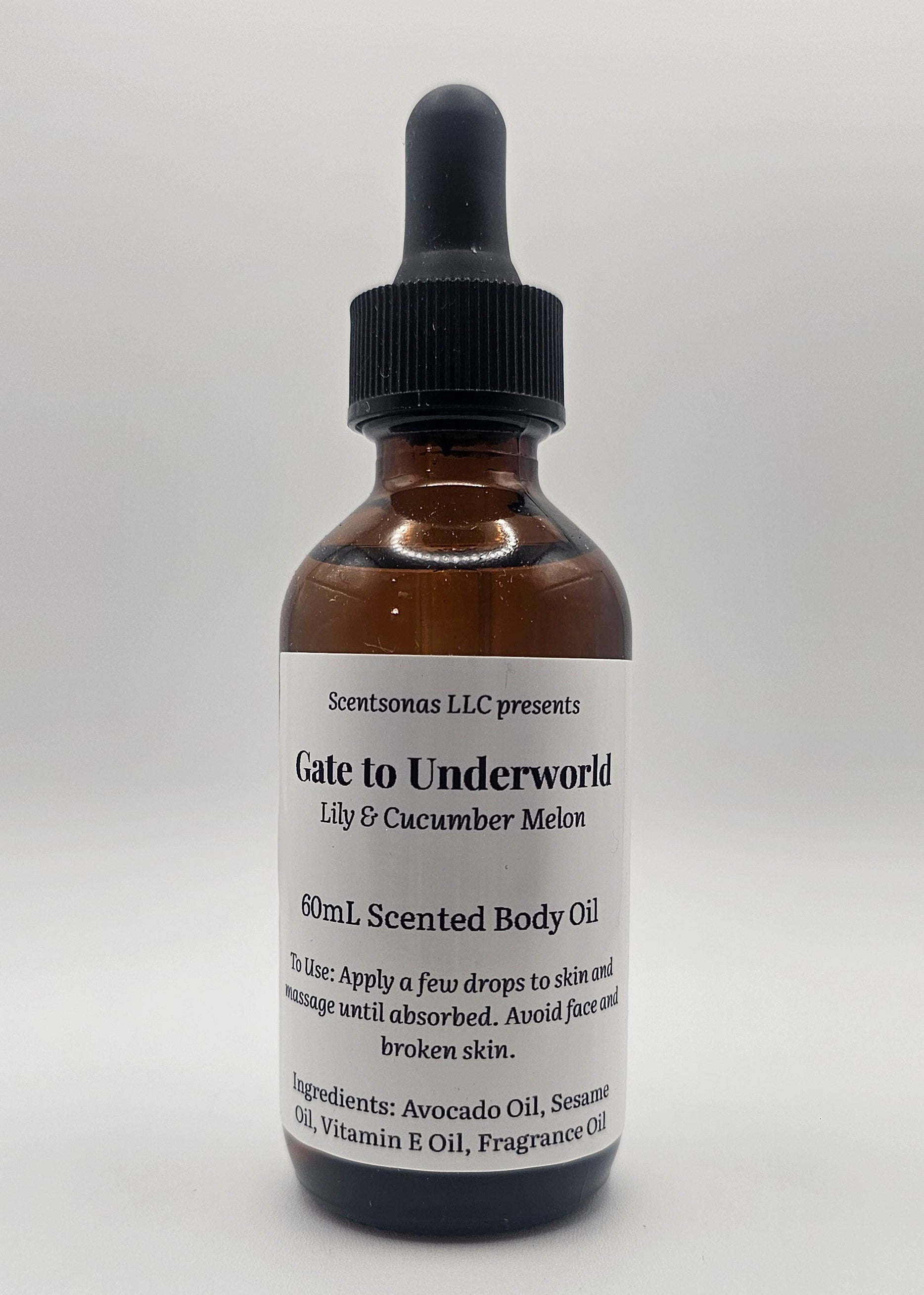 Bottle of 'Gate to Underworld' body oil with dropper on a white background