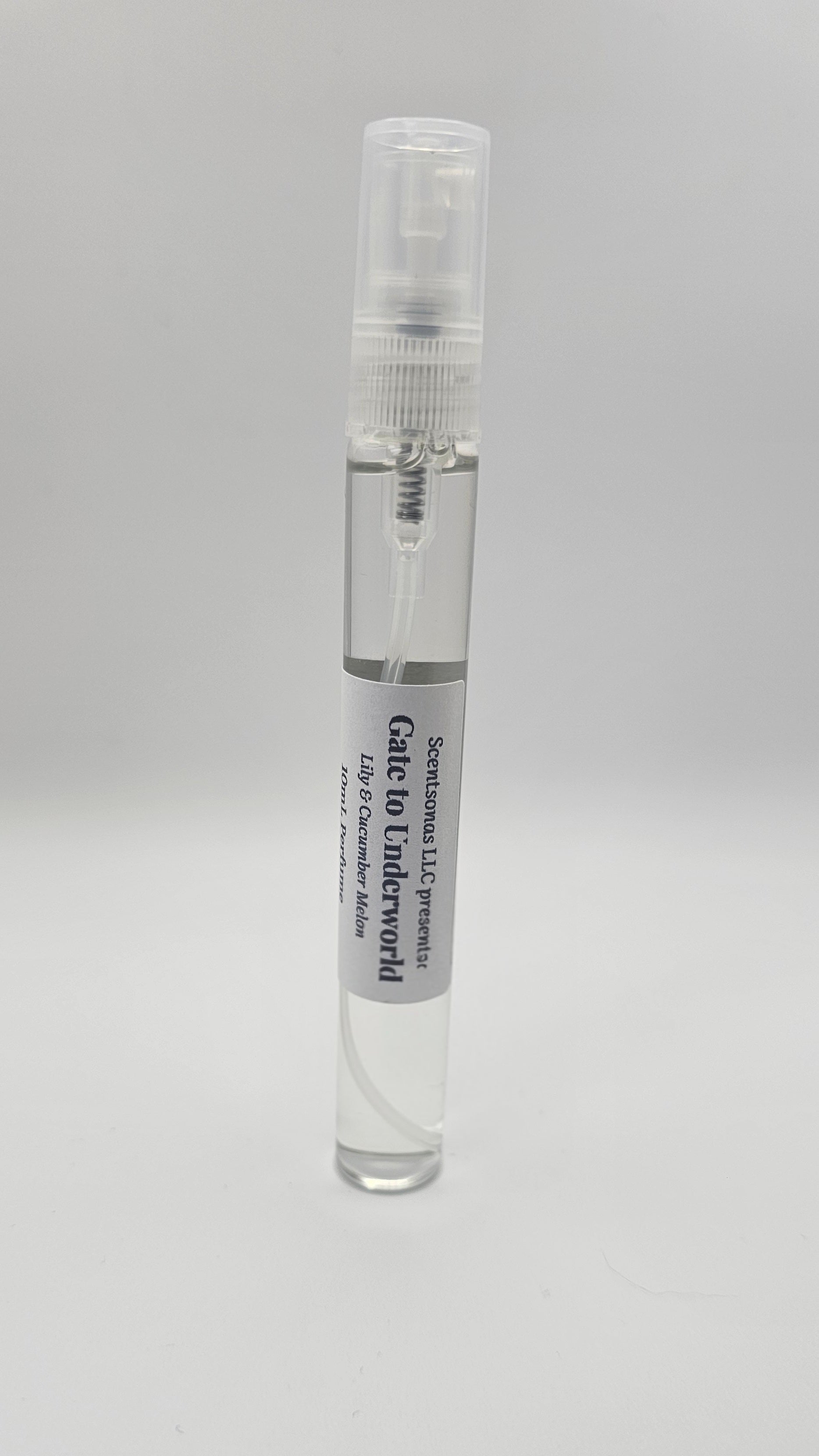 Small spray bottle with a label on a gray background