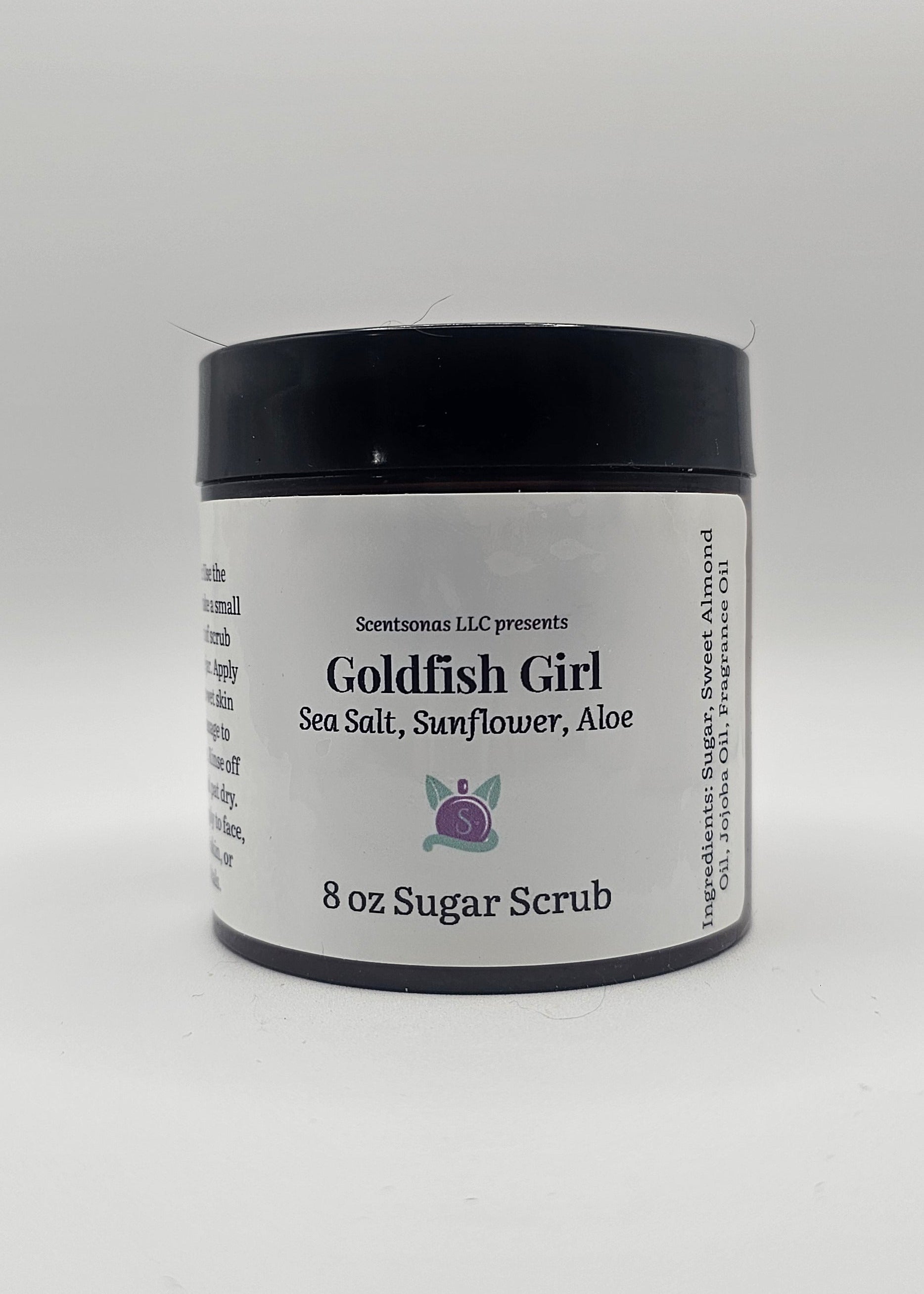 Jar of Goldfish Girl Sea Salt & Sunflower Aloe Sugar Scrub on a white background