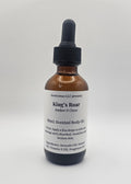 Bottle of King's Roar body oil on a white background