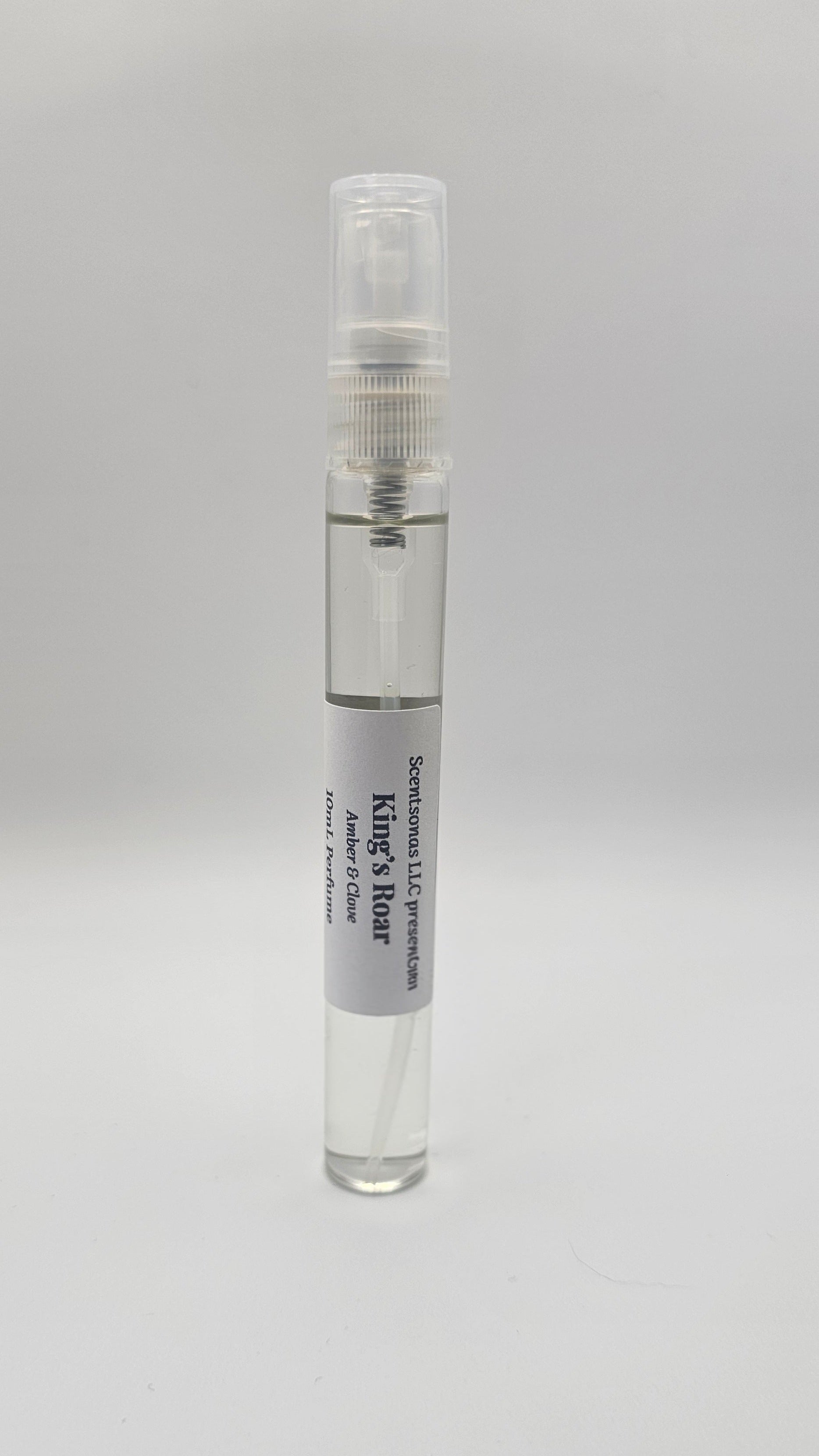 Small spray bottle with a label on a gray background