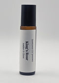 Roll-on bottle labeled 'King's Roar' with black cap and white body on a light gray background