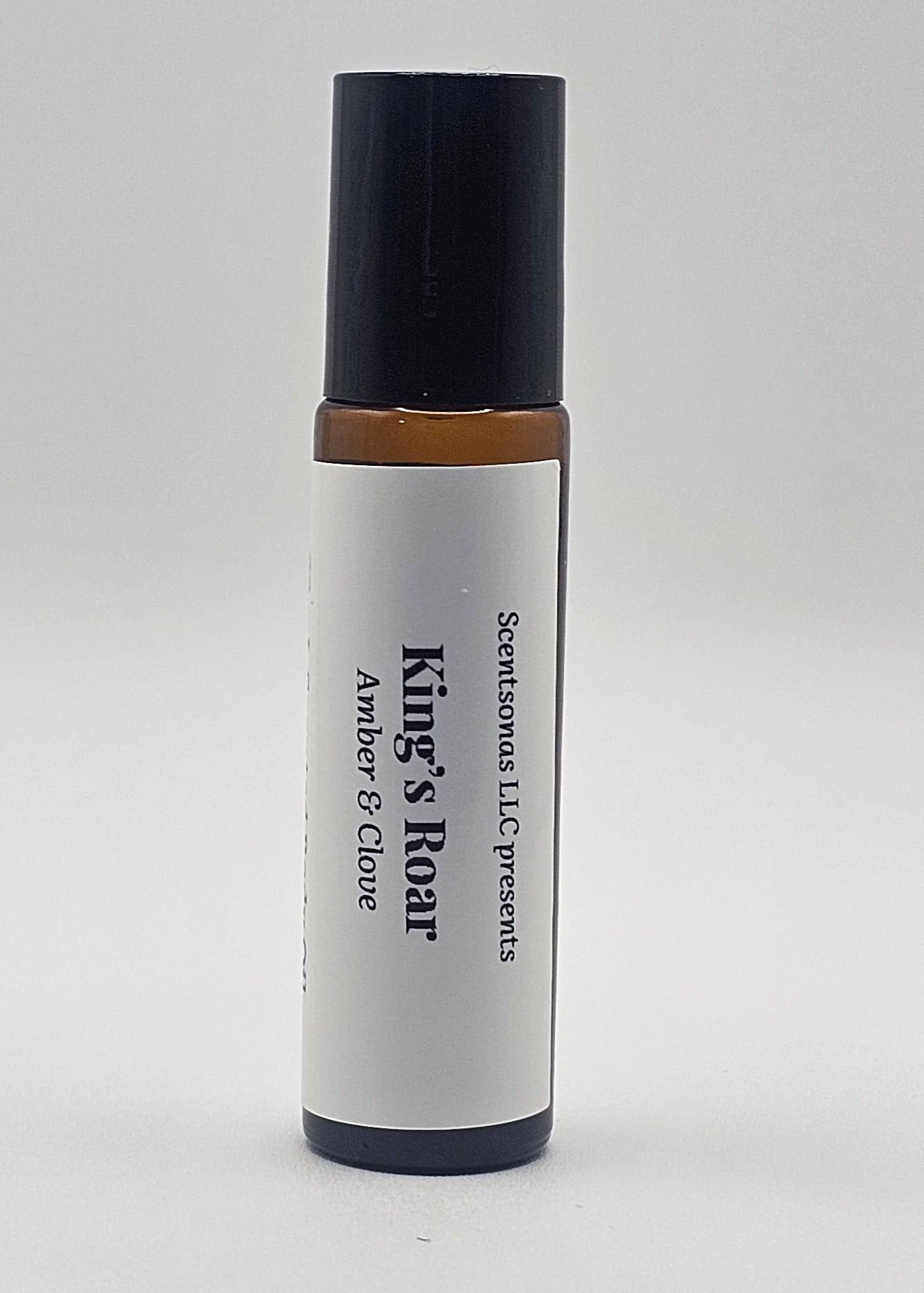 Roll-on bottle labeled 'King's Roar' with black cap and white body on a light gray background
