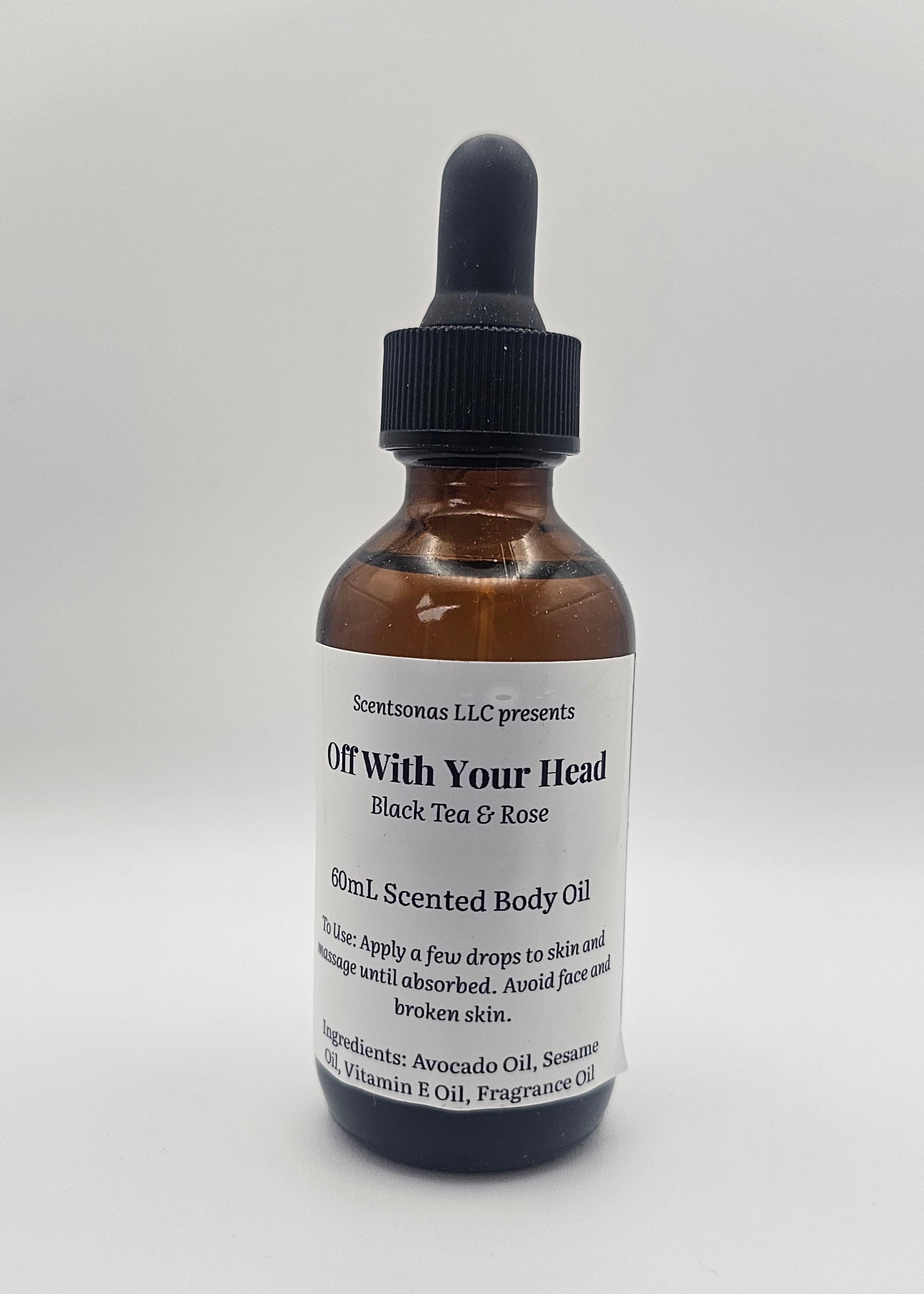 Bottle of 'Off With Your Head' body oil on a white background