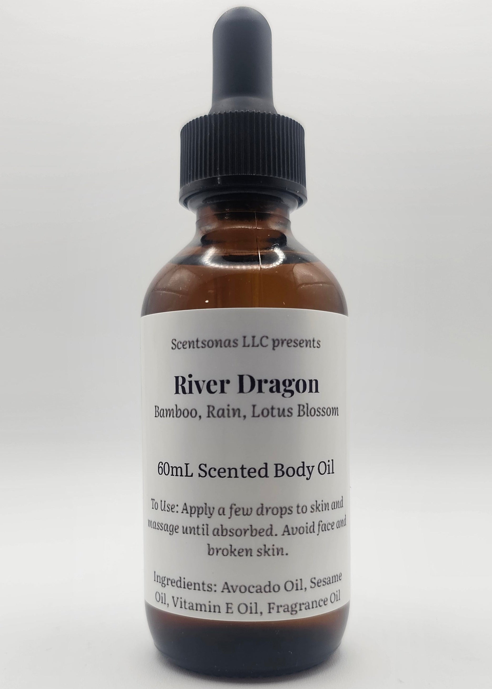 Bottle of River Dragon body oil with dropper on a white background