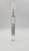 Small clear glass bottle with a white cap on a gray background