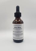 Bottle of Silver Sleep body oil with dropper on a white background
