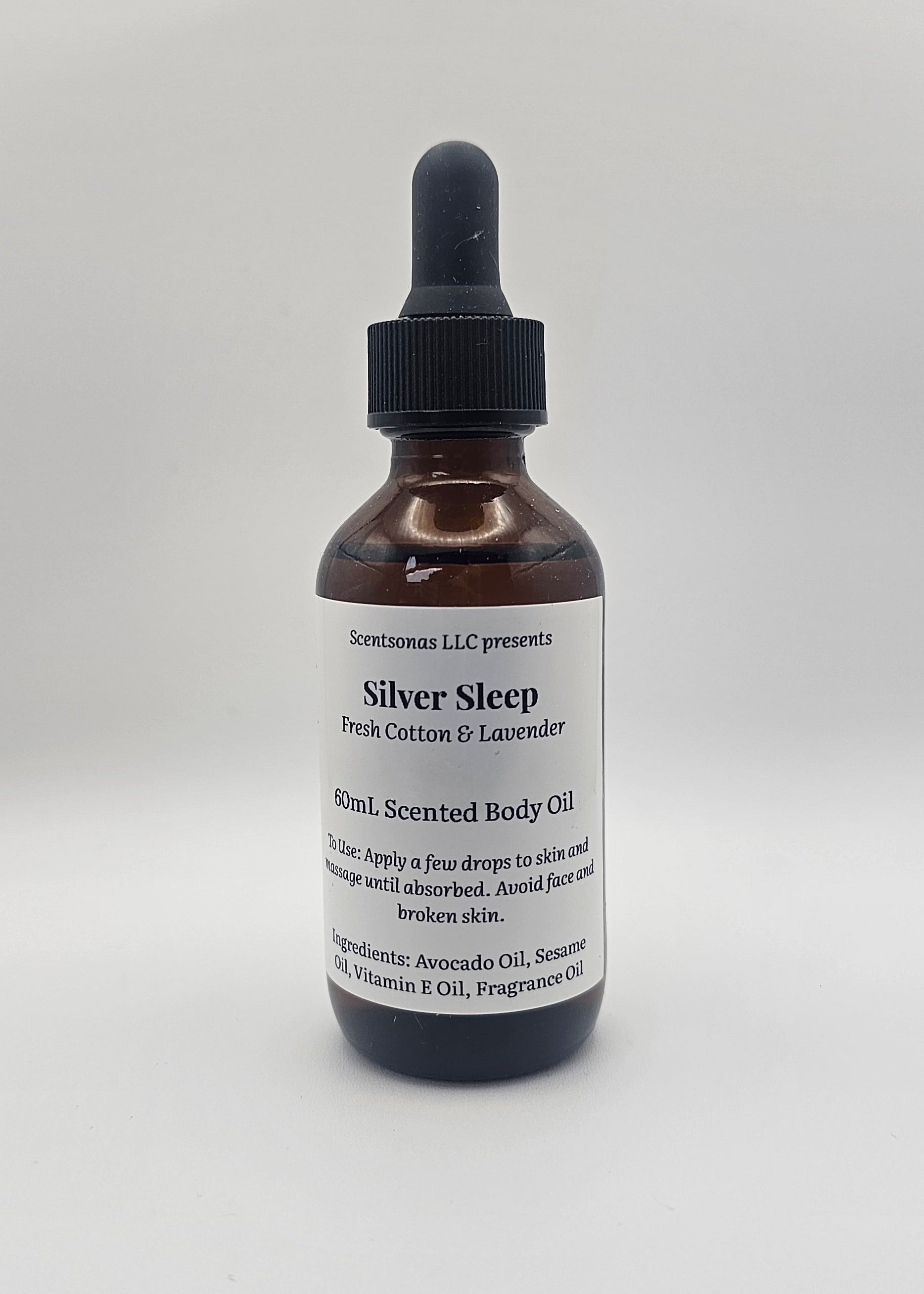 Bottle of Silver Sleep body oil with dropper on a white background