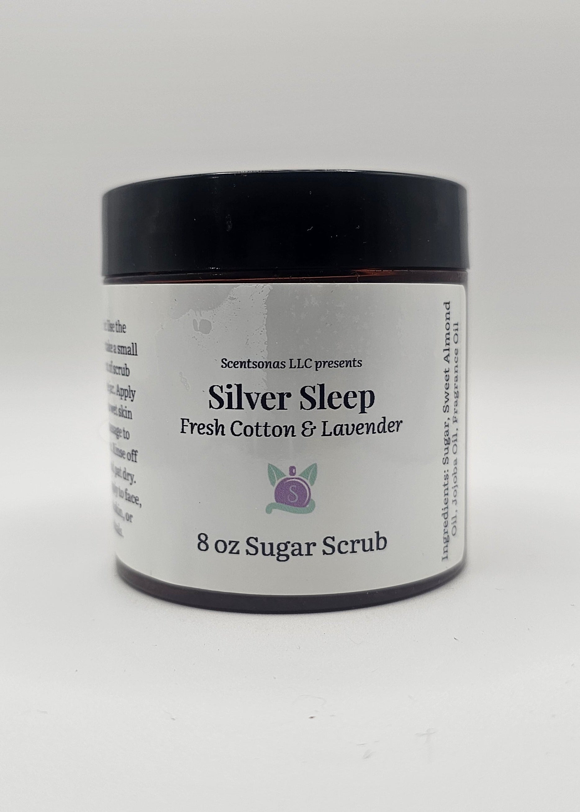 Jar of Silver Sleep sugar scrub with a black lid on a white background