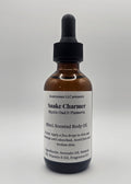 Bottle of Snake Charmer oil with a label on a white background