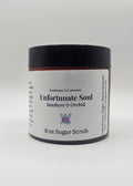 Jar of sugar scrub with a black lid on a white background