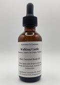Bottle of walking castle body oil with a dropper on a white background