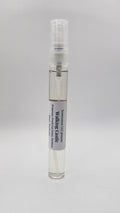 Small spray bottle with a gray label on a light gray background