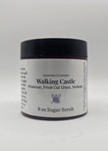 Jar of 'Walking Castle' sugar scrub on a white background