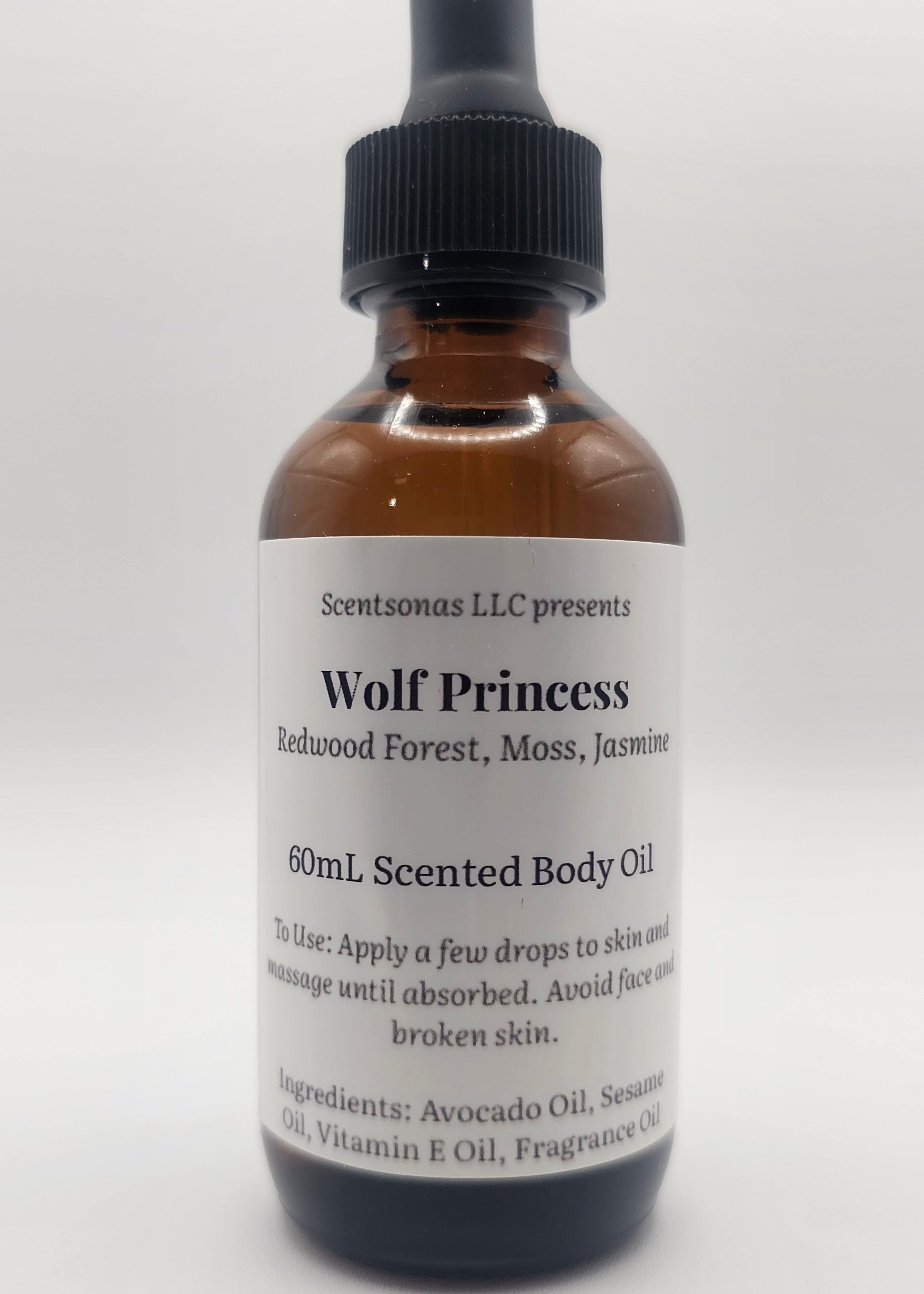 Bottle of Wolf Princess scented body oil on a white background